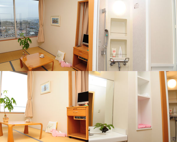 奥に大きく窓があり中央にテーブルがある畳の部屋